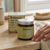 Balance high-strength CBD cream jar and box beside a hand
